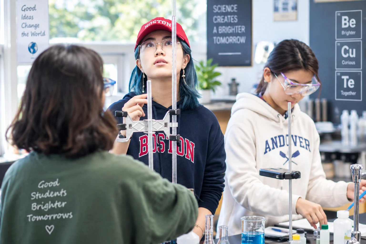 Students wearing safety glasses while working with laboratory equipment